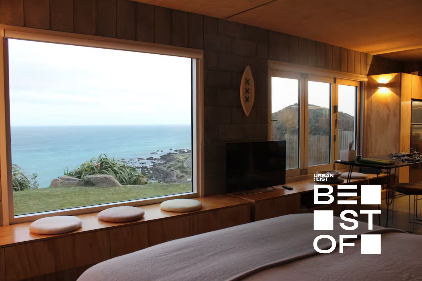 Sea views from the window of a cliff-side Wellington airbnb.